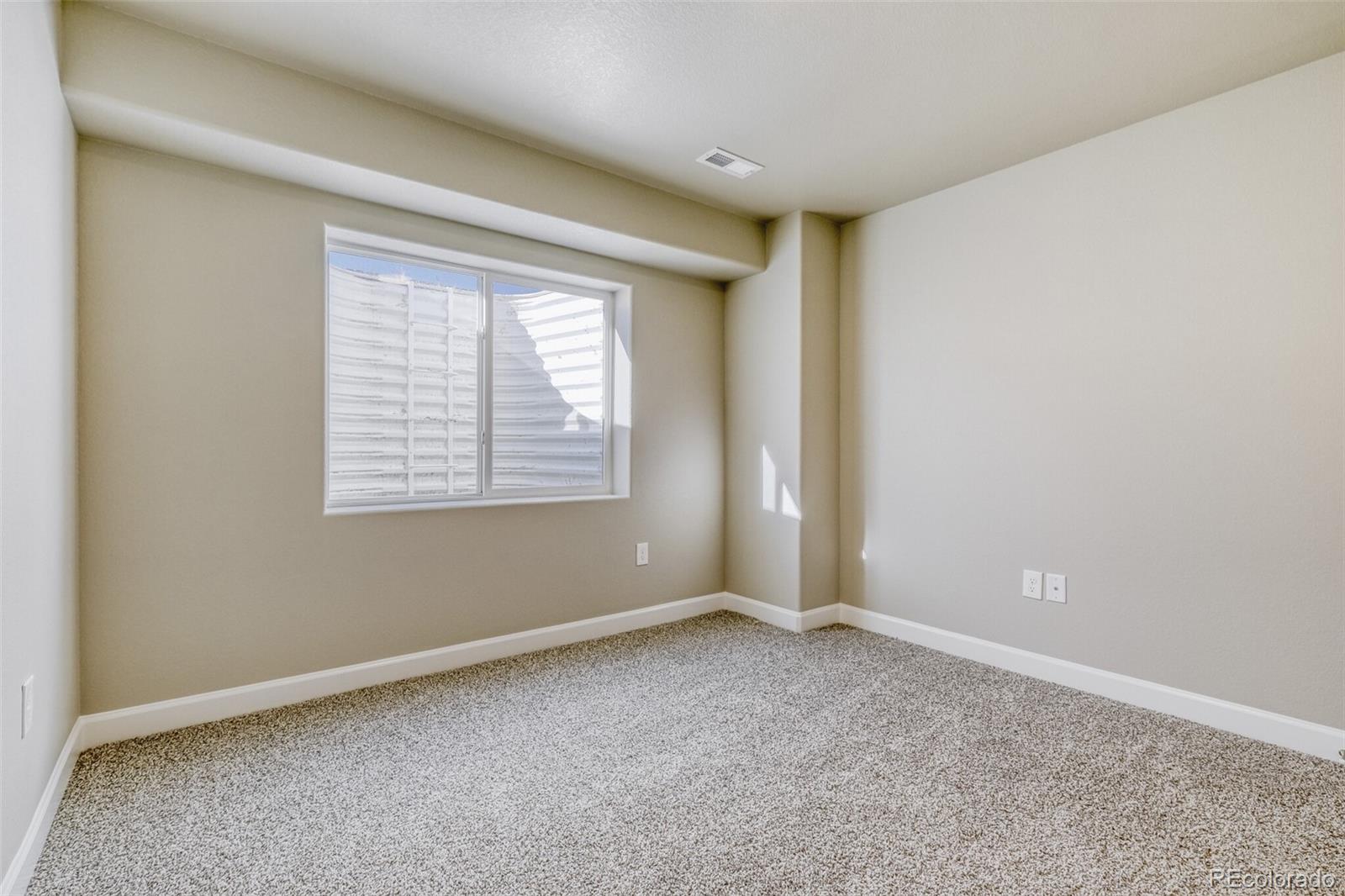 9093 Peaceful Valley Road Colorado Springs, CO 80925 - Photo 35 of 42 an empty room with windows