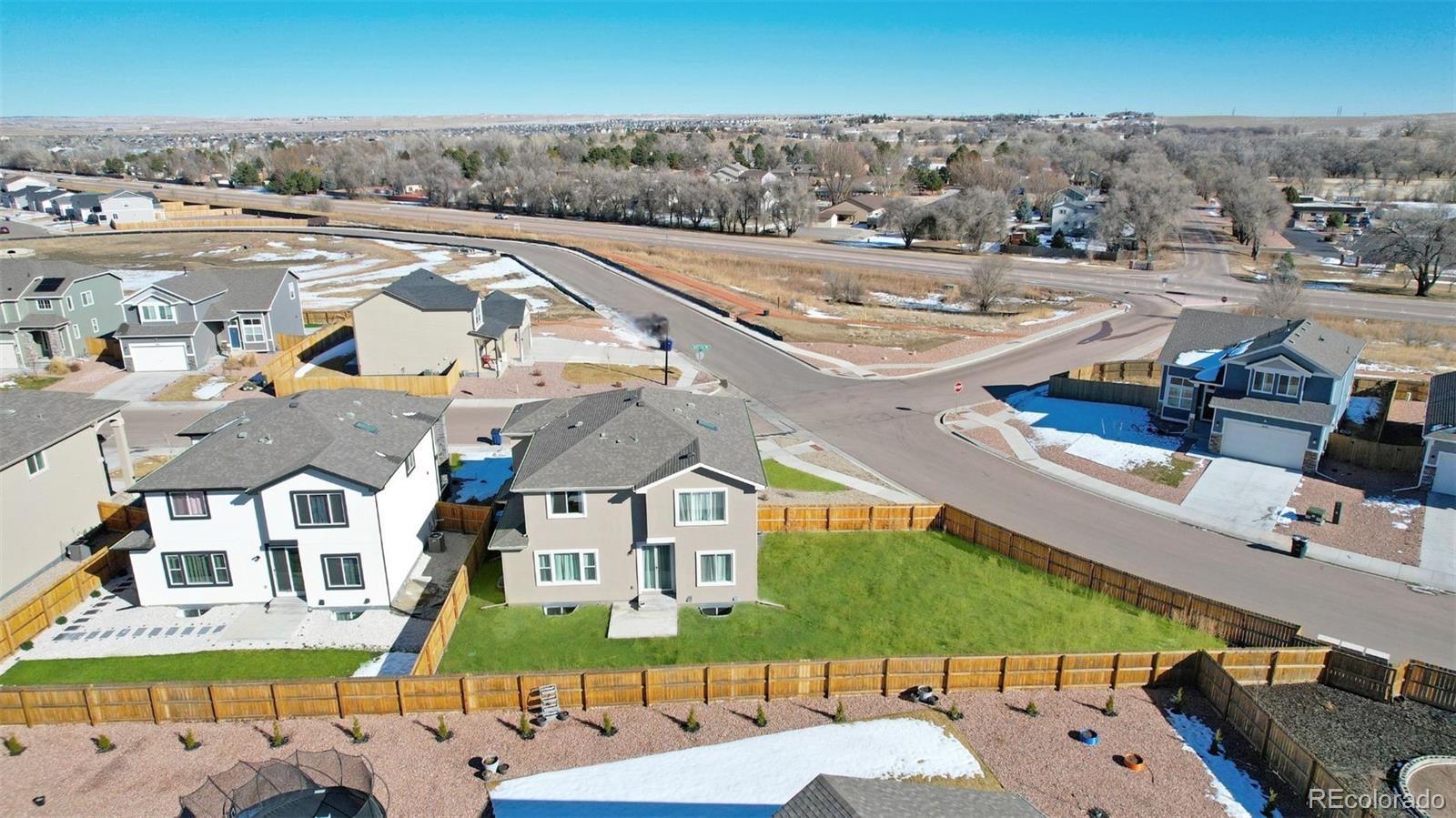 9093 Peaceful Valley Road Colorado Springs, CO 80925 - Photo 39 of 42 an aerial view of residential houses with outdoor space