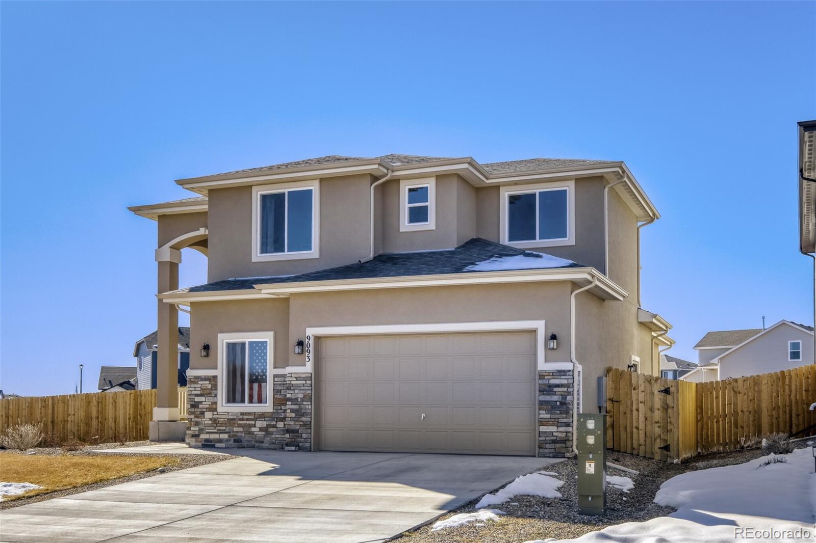 9093 Peaceful Valley Road Colorado Springs, CO 80925 - Photo 4 of 42 a view of a house with a garage