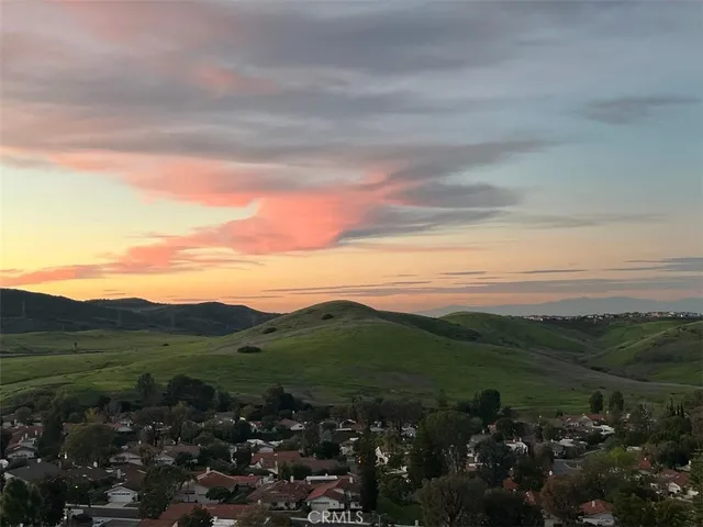 a view of a city with mountains in the background