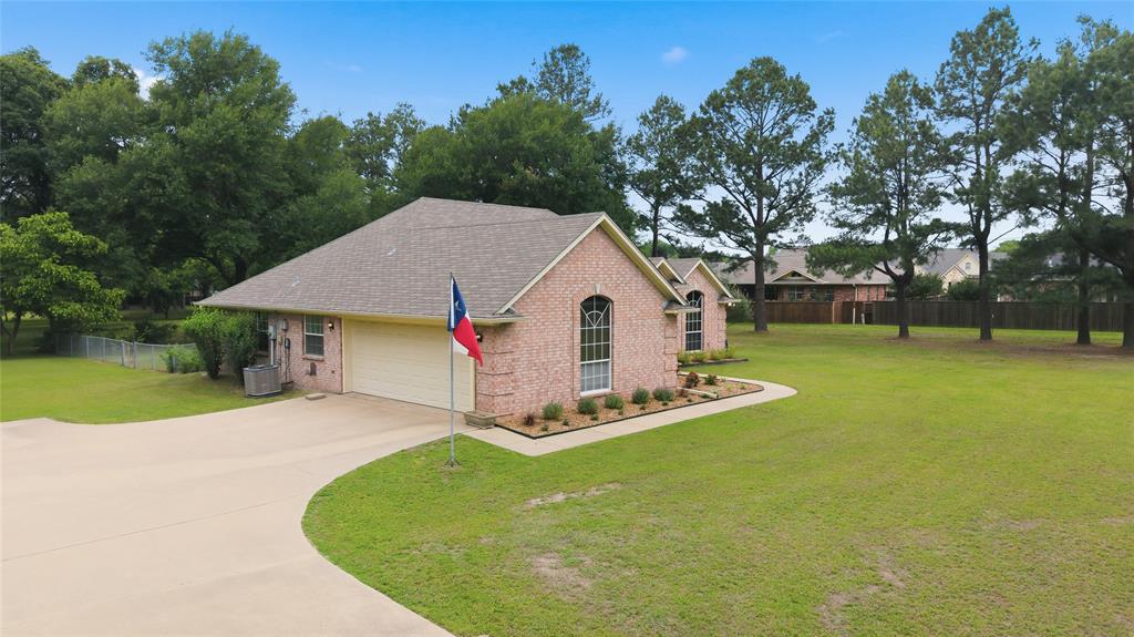 2917 Harlow Road Commerce, TX 75428 - Photo 39 of 40 a view of a house with backyard and tree s