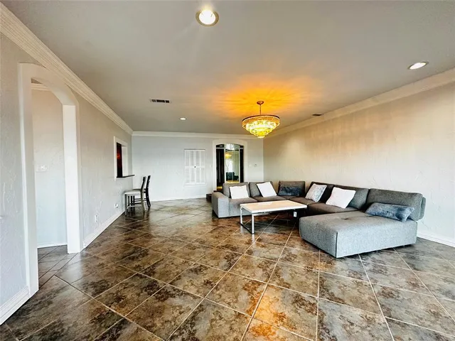 a living room with furniture and a rug