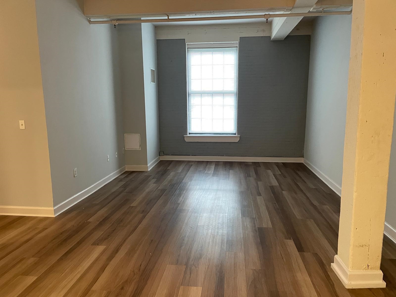 160 Lafayette Street, Unit 52306 Jersey City, NJ 07304 - Photo 13 of 25 a view of a room with wooden floor and a window