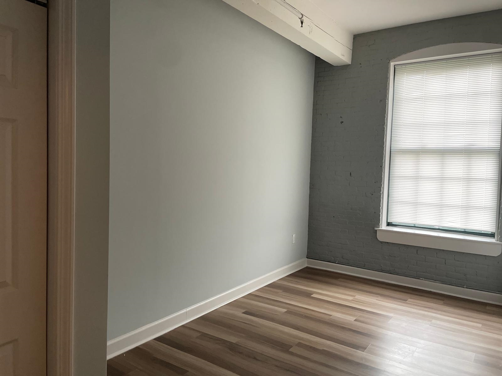 160 Lafayette Street, Unit 52306 Jersey City, NJ 07304 - Photo 14 of 25 a view of empty room with wooden floor and fan