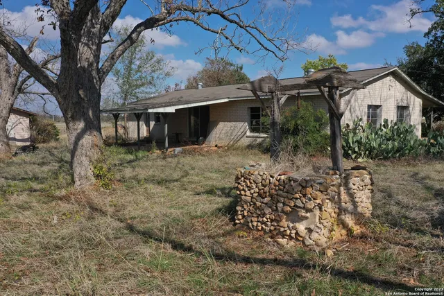 a house view with a backyard space