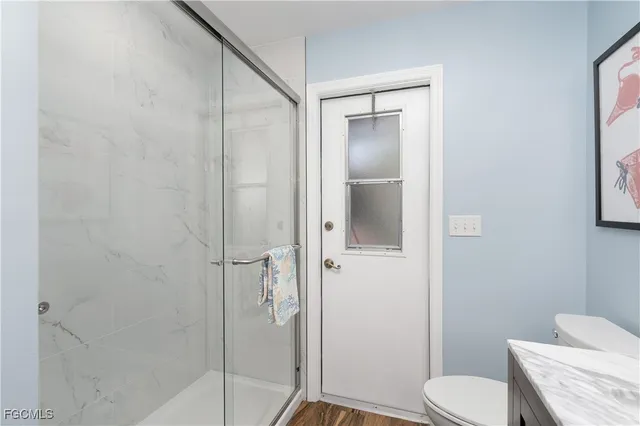 a living room with furniture a rug and a large window