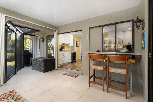 a backyard of a house with outdoor seating