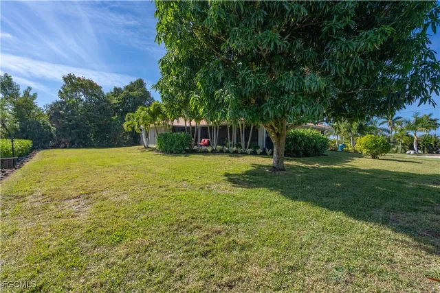 a view of a house with a big yard