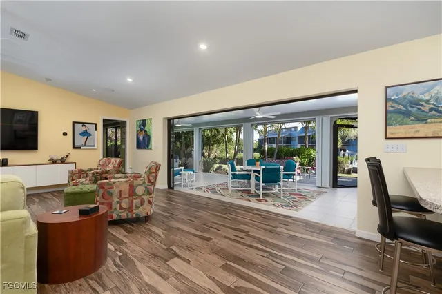 a view of a dining room with furniture and wooden floor