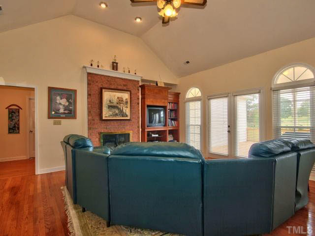 6820 Winding Ridge Road Zebulon, NC 27597 - Photo 8 of 25 This view of the family room shows how you can sit inside and still enjoy the beauty of the outdoors.