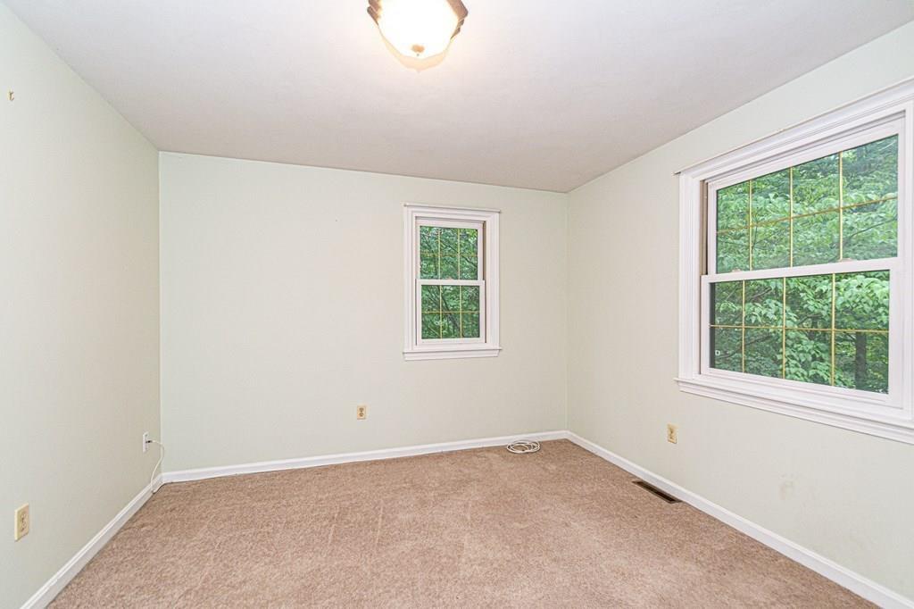 487 Boston Road Groton, MA 01450 - Photo 22 of 32 an empty room with a window