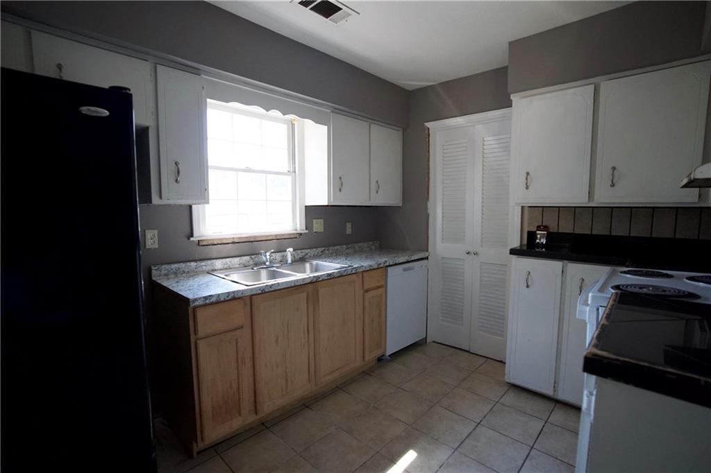 3091 Mustang Drive Columbus, GA 31909 - Photo 12 of 18 a kitchen with a sink stove and refrigerator