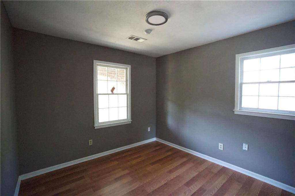 3091 Mustang Drive Columbus, GA 31909 - Photo 15 of 18 an empty room with wooden floor and windows
