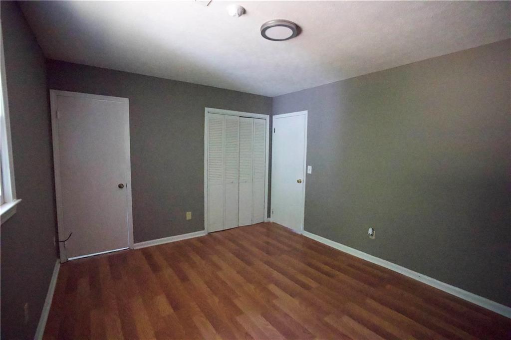 3091 Mustang Drive Columbus, GA 31909 - Photo 17 of 18 a view of an empty room and wooden floor