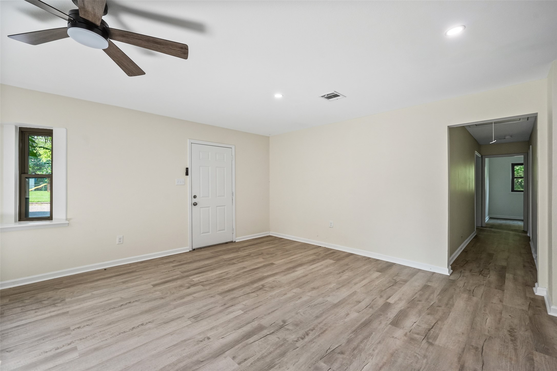 725 Lafayette Street Hempstead, TX 77445 - Photo 12 of 20 Living room featuring recessed lighting, updated flooring, and natural light