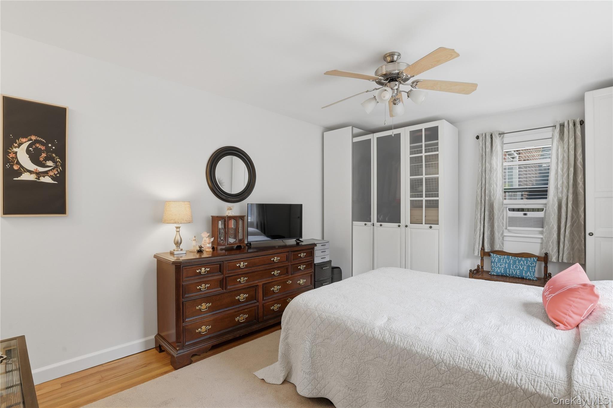 352 North State Road, Unit 1H Briarcliff Manor, NY 10510 - Photo 17 of 20 a bedroom with a bed and a table