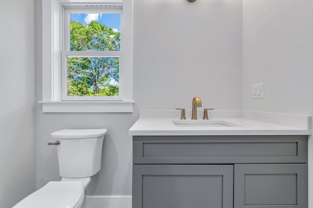 25 Percival Road Falmouth, MA 02536 - Photo 21 of 30 a bathroom with a sink a toilet and a window