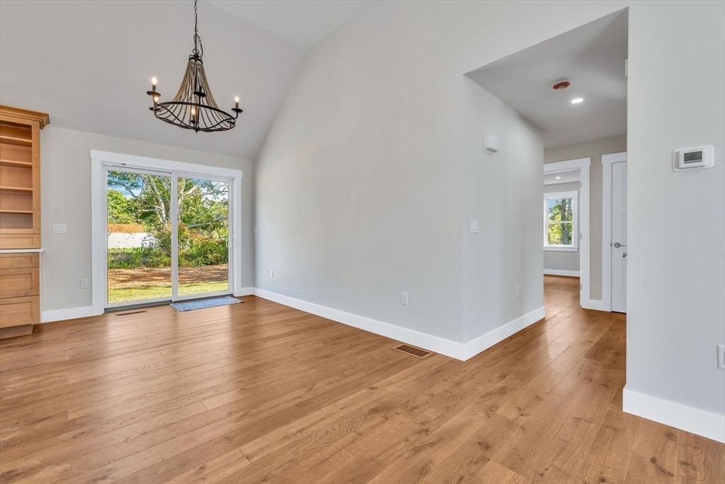 25 Percival Road Falmouth, MA 02536 - Photo 24 of 30 a view of an empty room with wooden floor and a window