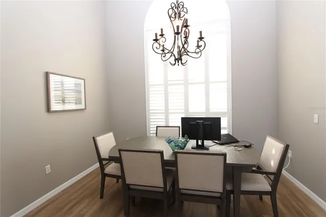 a view of a dining room with furniture window and outside view