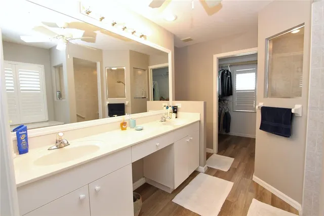 a bathroom with a double vanity sink and mirror