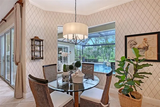 a view of a workspace with furniture and a bookshelf