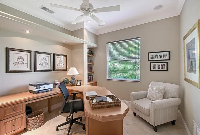 a front view of a building with a garden