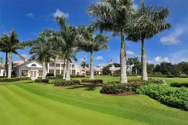a view of a patio with couches table and chairs and potted plants