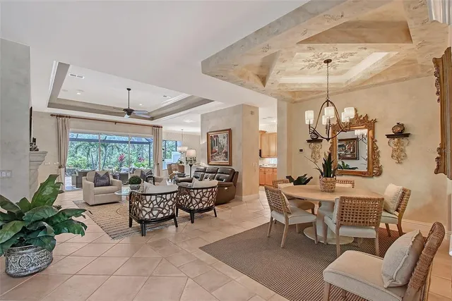 a kitchen with stainless steel appliances granite countertop a sink a stove and a wooden floors