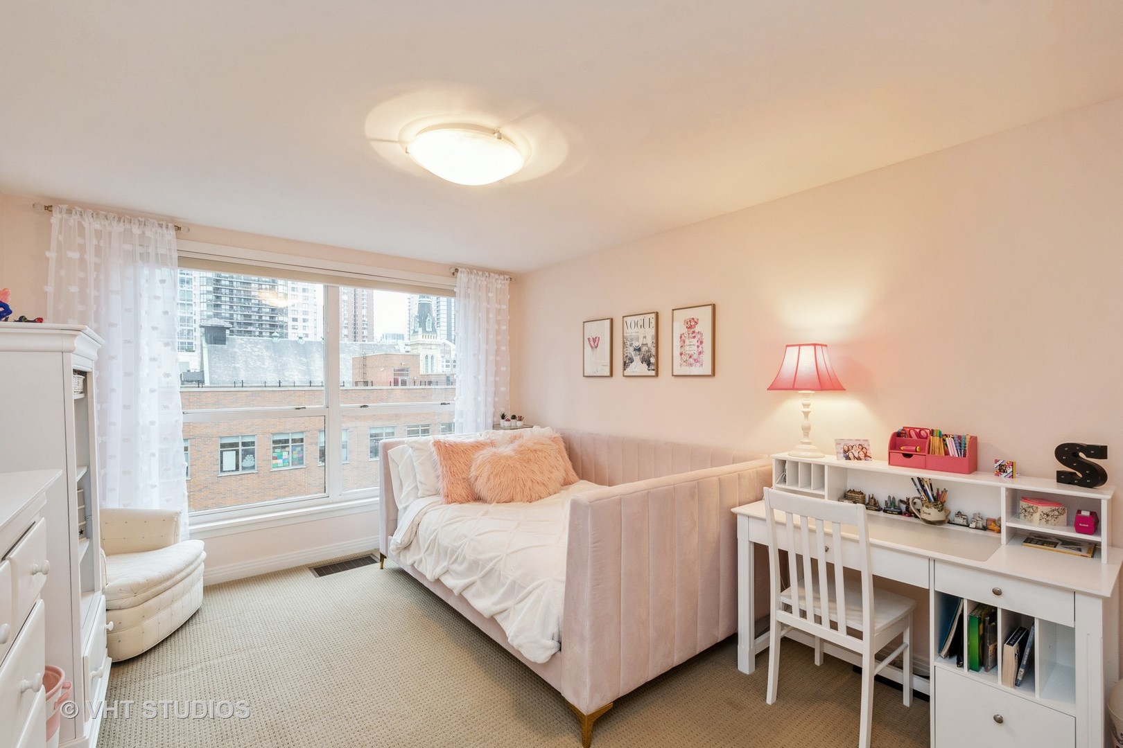 1000 North State Street, Unit 13 Chicago, IL 60610 - Photo 19 of 45 a bedroom with furniture and a large window