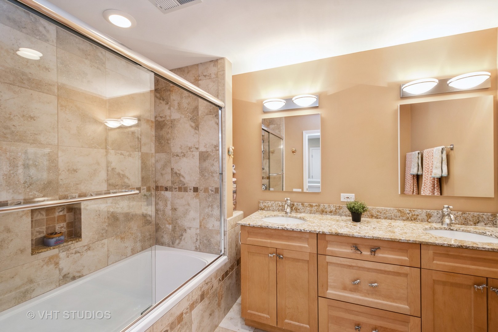 1000 North State Street, Unit 13 Chicago, IL 60610 - Photo 20 of 45 a bathroom with a granite countertop sink mirror and a bath tub