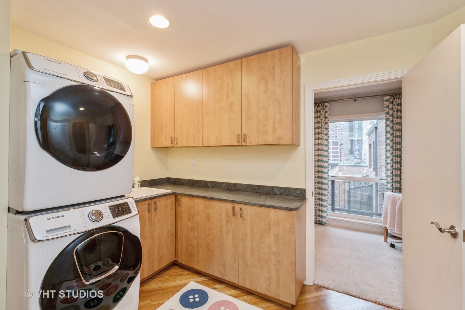 1000 North State Street, Unit 13 Chicago, IL 60610 - Photo 22 of 45 a utility room with dryer and washer