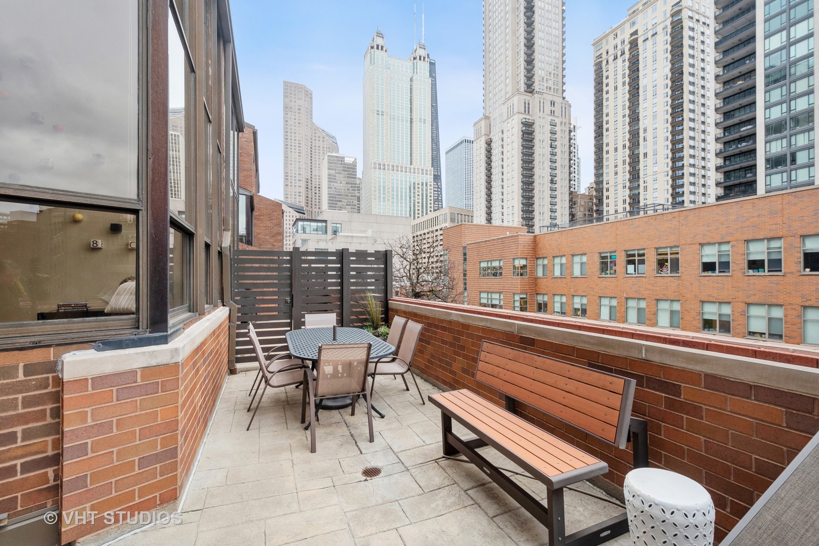 1000 North State Street, Unit 13 Chicago, IL 60610 - Photo 26 of 45 a balcony with outdoor seating and city view