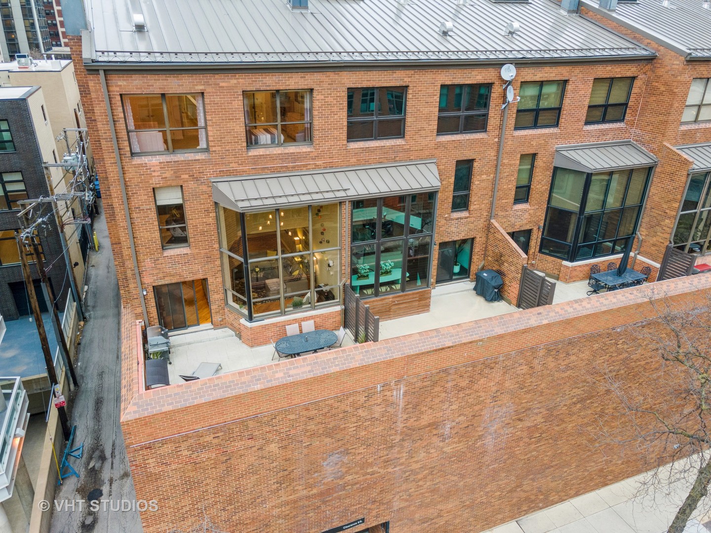 1000 North State Street, Unit 13 Chicago, IL 60610 - Photo 34 of 45 a view of a brick building with many windows