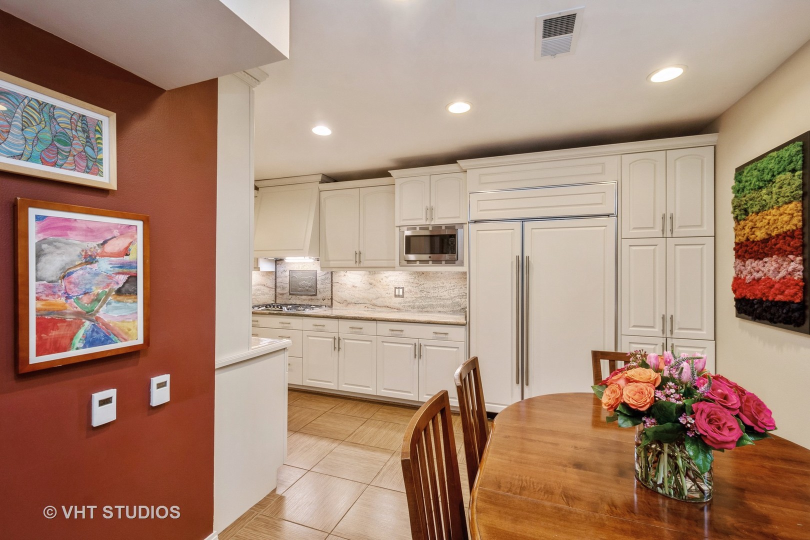 1000 North State Street, Unit 13 Chicago, IL 60610 - Photo 7 of 45 a kitchen that has a lot of cabinets a sink and a refrigerator in it