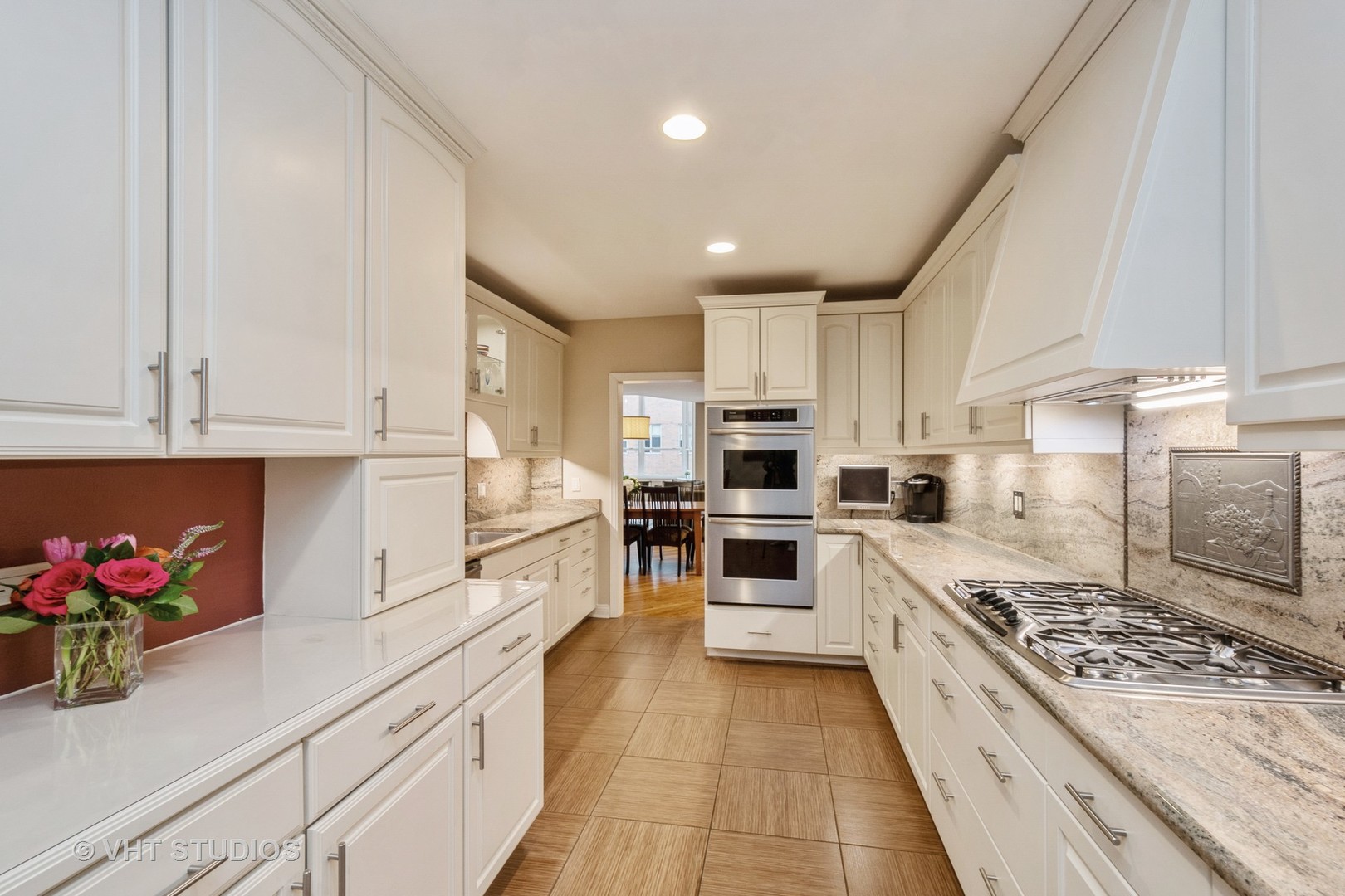 1000 North State Street, Unit 13 Chicago, IL 60610 - Photo 9 of 45 a kitchen with white cabinets and appliances
