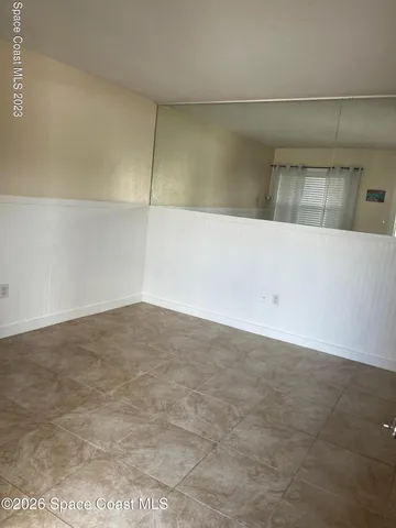 a view of a room with an empty space