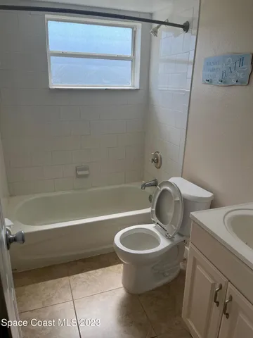 a bathroom with a sink a toilet and a bathtub