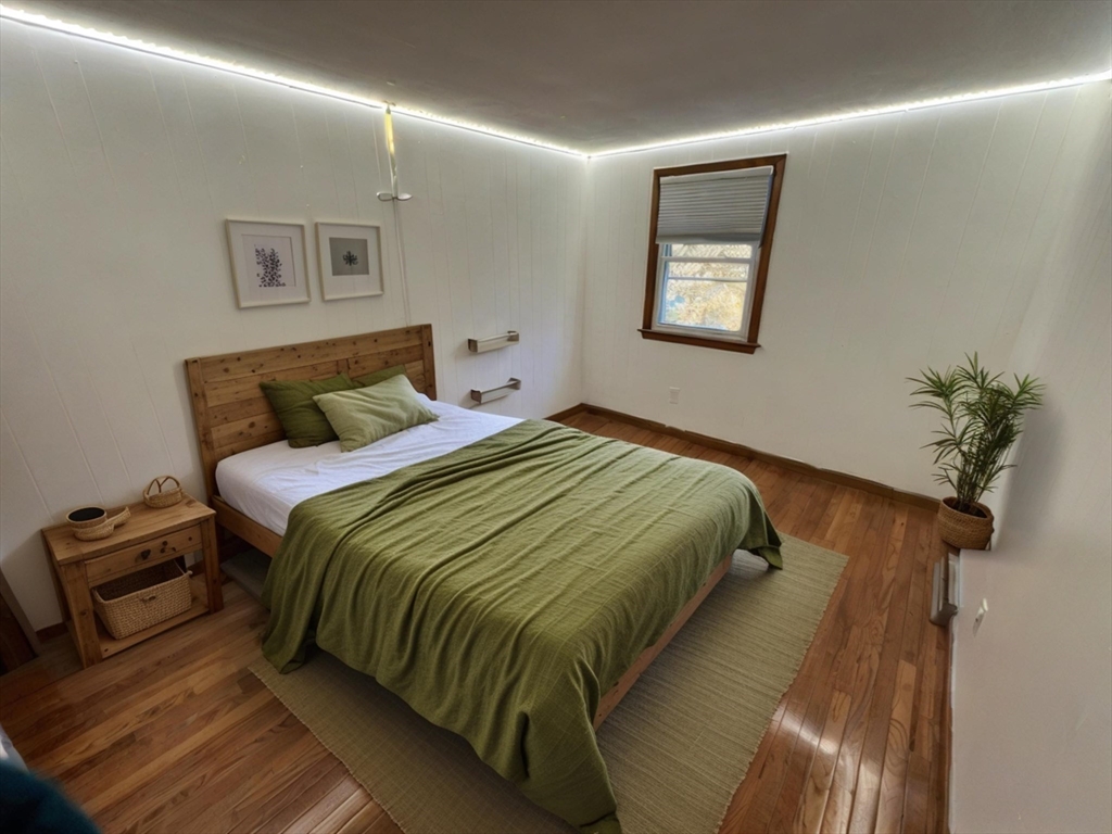 960 Westhampton Road Northampton, MA 01062 - Photo 14 of 30 a bedroom with a bed and a potted plant