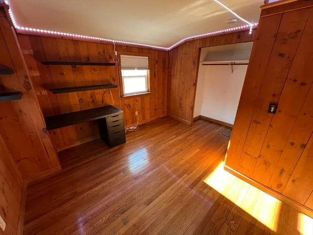 a view of front door with wooden floor