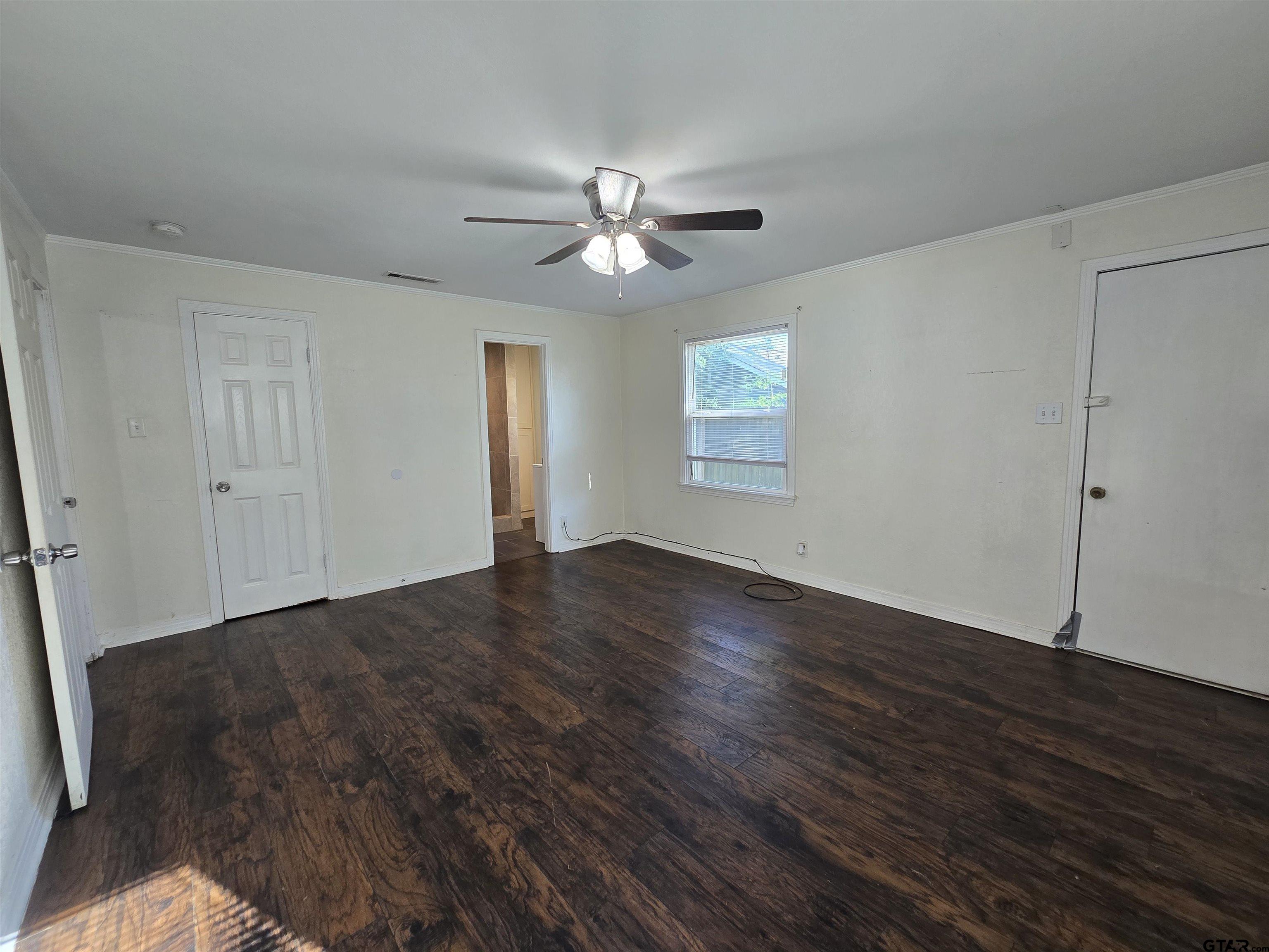 3623 New Copeland Road Tyler, TX 75701 - Photo 23 of 42 a view of empty room with wooden floor and fan
