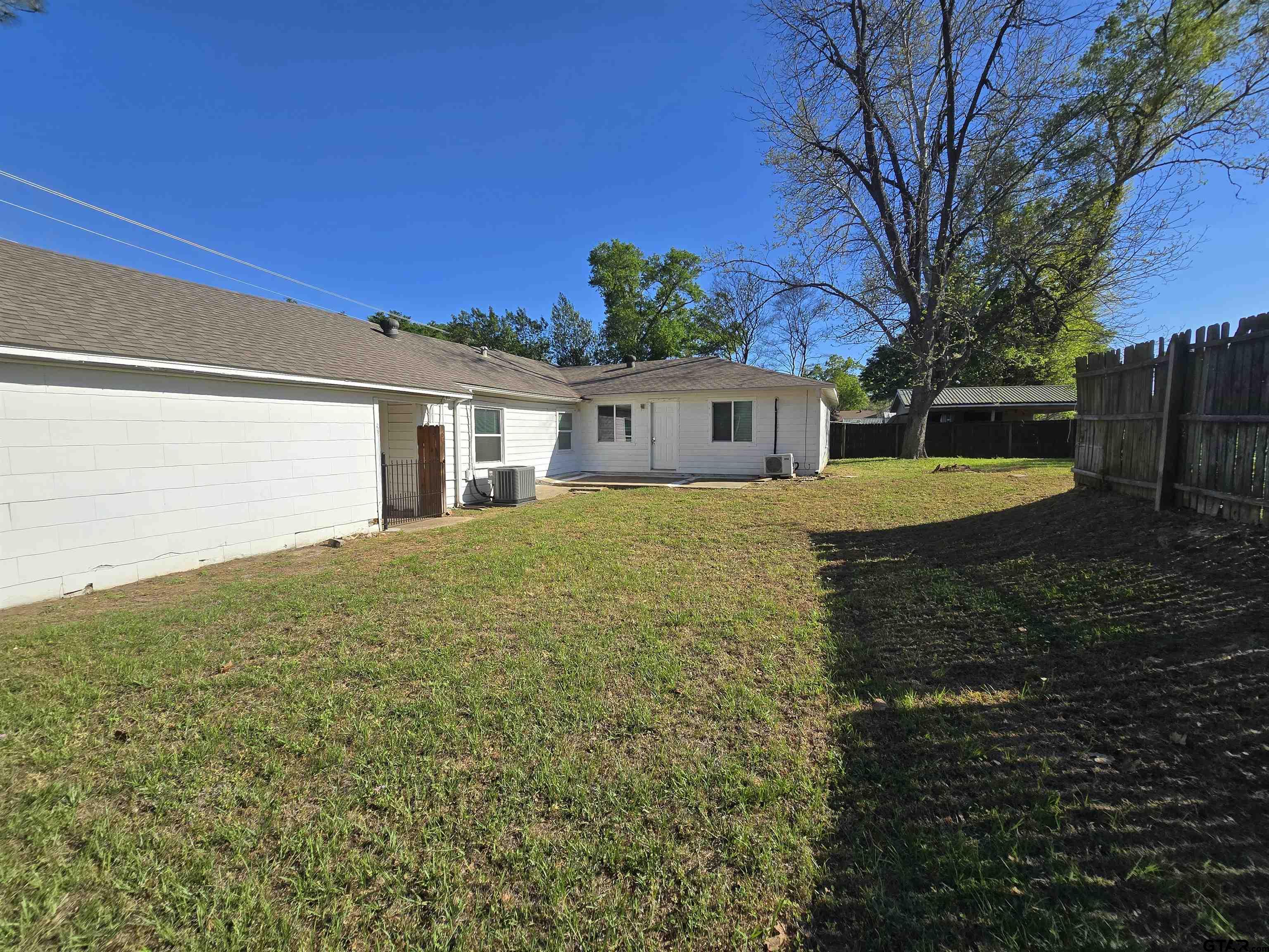 3623 New Copeland Road Tyler, TX 75701 - Photo 38 of 42 a view of a house with a yard