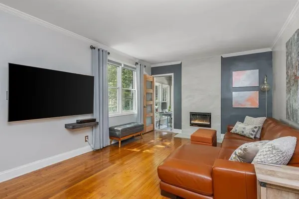 a living room with furniture and a flat screen tv