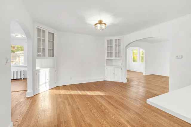 a kitchen with granite countertop a stove a sink and a microwave
