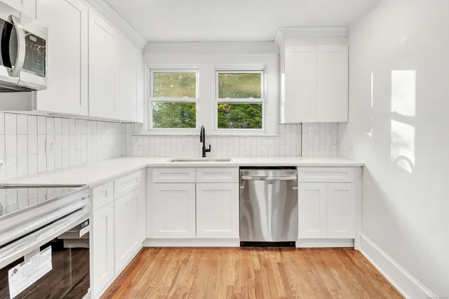 a view of front door with wooden floor