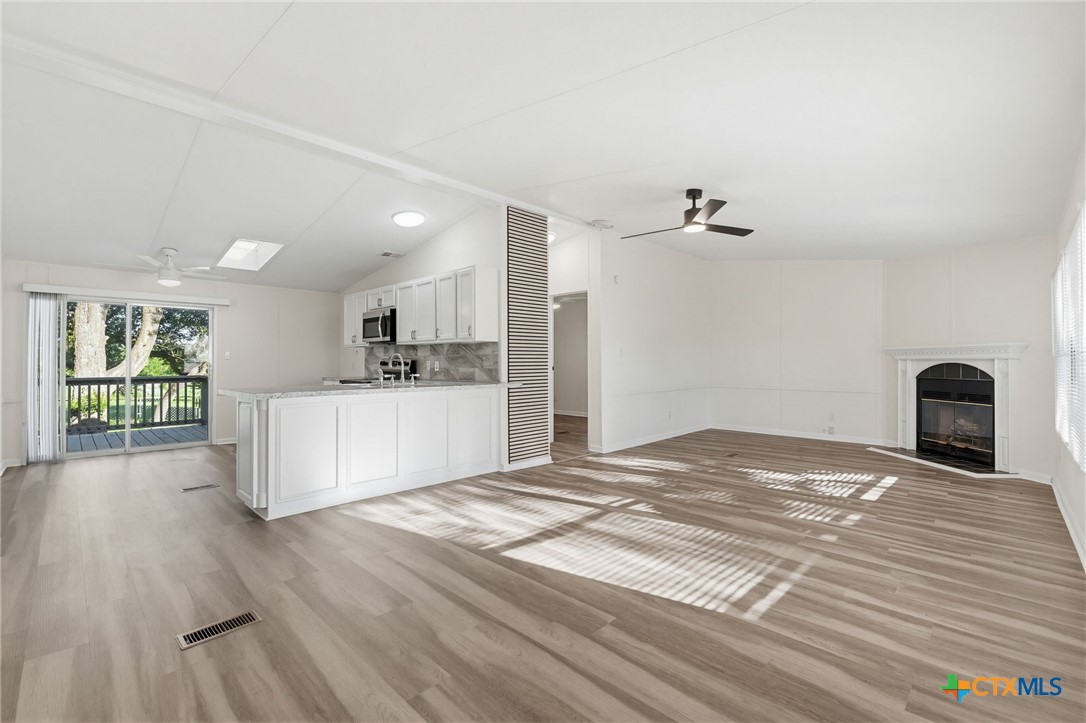 2739 Willow Loop Kempner, TX 76539 - Photo 5 of 30 a view of a kitchen with wooden floor and a kitchen
