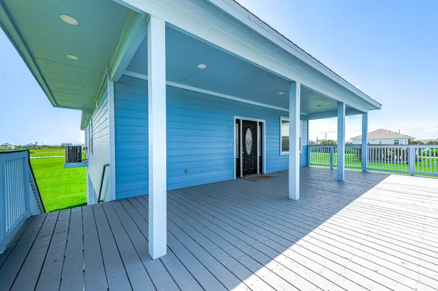 a house with wooden floor and outdoor space