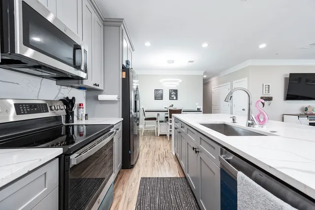 a kitchen with a stove and a microwave