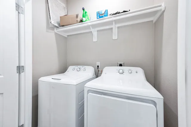 a bedroom with a large bed and a tv