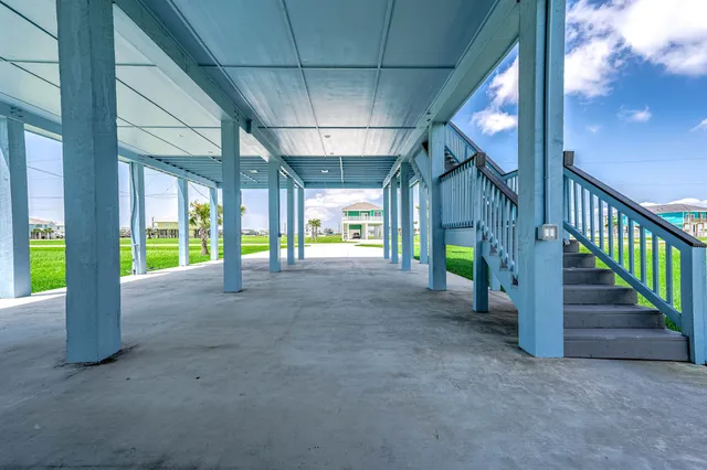 a view of an empty room with staircase
