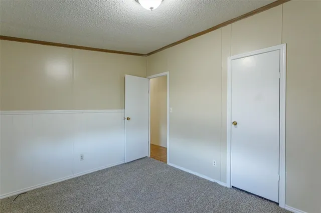 a large kitchen with a large counter top space and stainless steel appliances